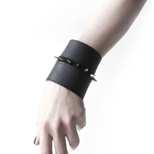 Black leather cuff with spike studs | London - Angela Pinto