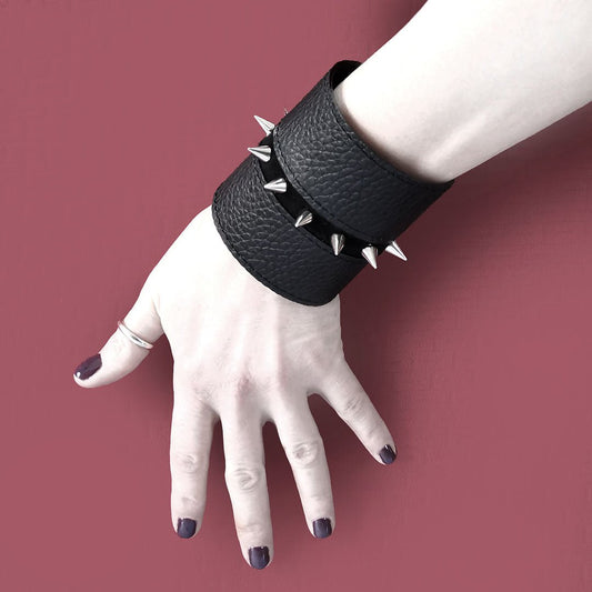 Black leather cuff with spike studs | London - Angela Pinto