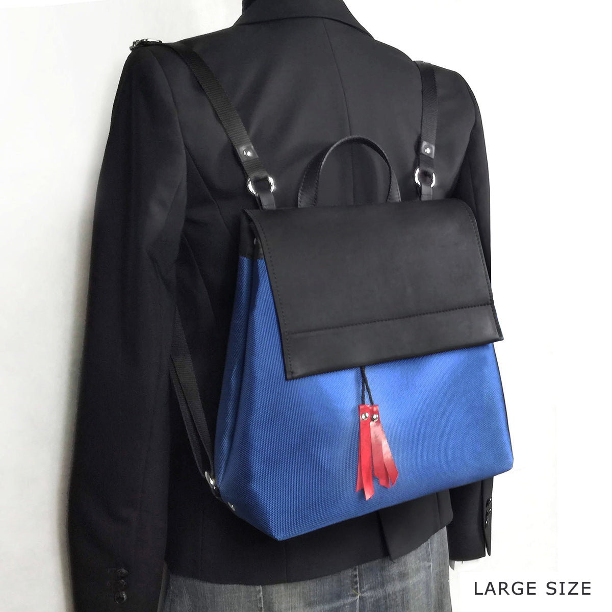 Blue and black convertible backpack | Alice